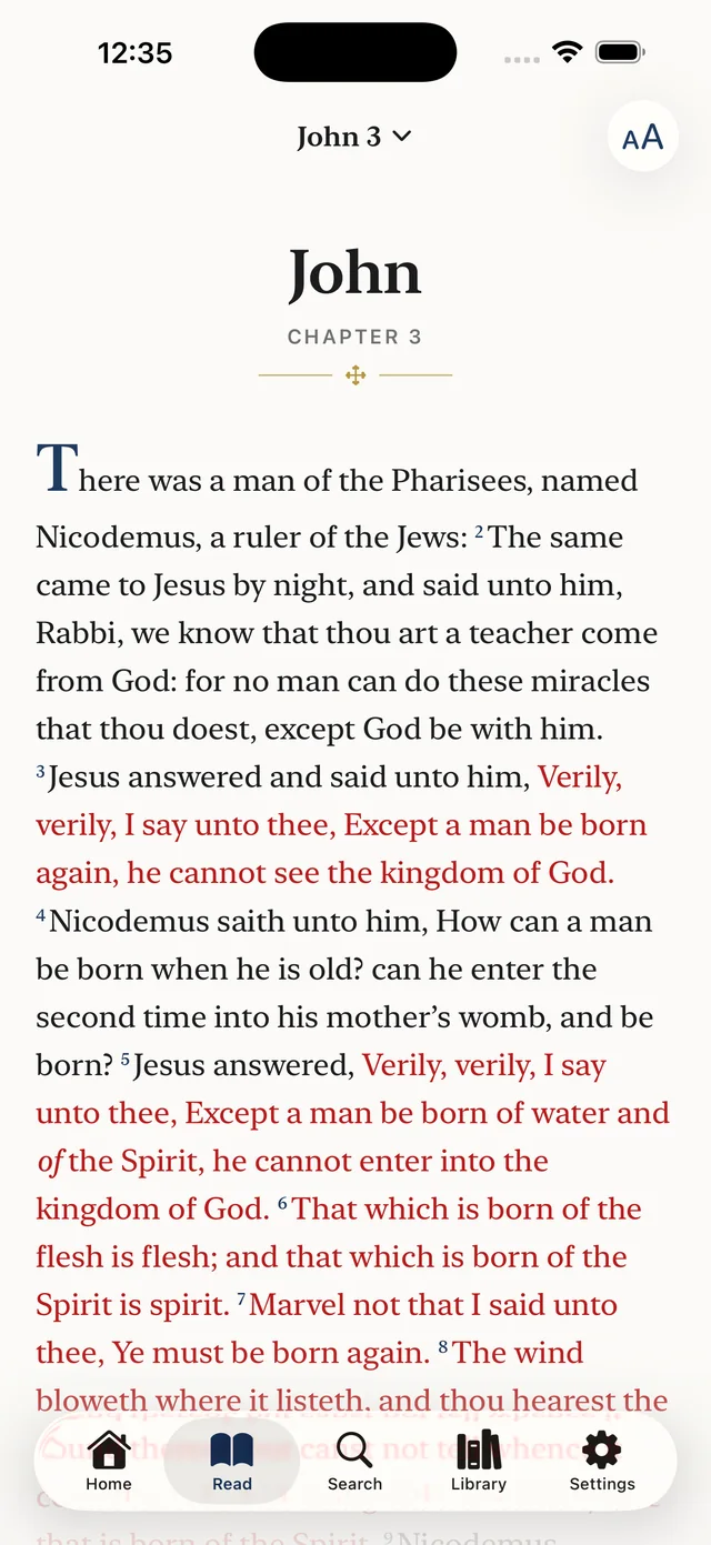 The reader: John 3 in the King James Version, with the words of Christ in red and a raised initial